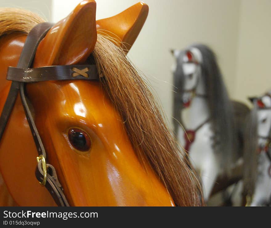 Close-up of varnished wooden rocking horse head