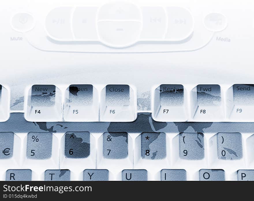 Media computer keyboard overlaid with world map. Media computer keyboard overlaid with world map