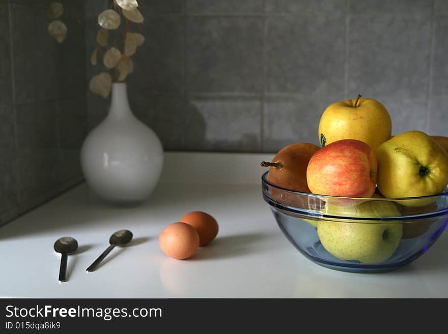 Kitchen composition with eggs and apples. Kitchen composition with eggs and apples