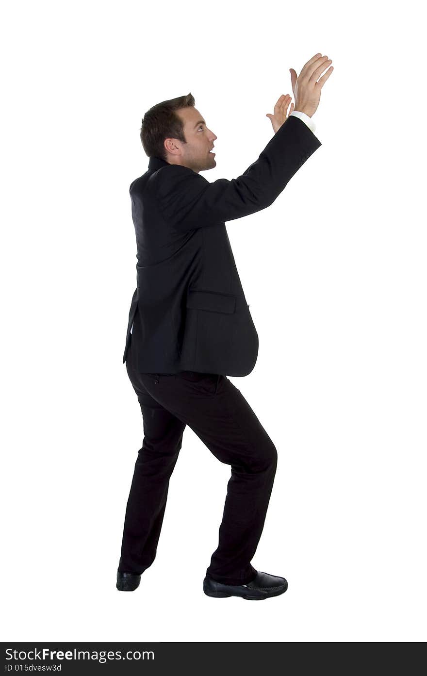 Side view of success businessman with raised hands