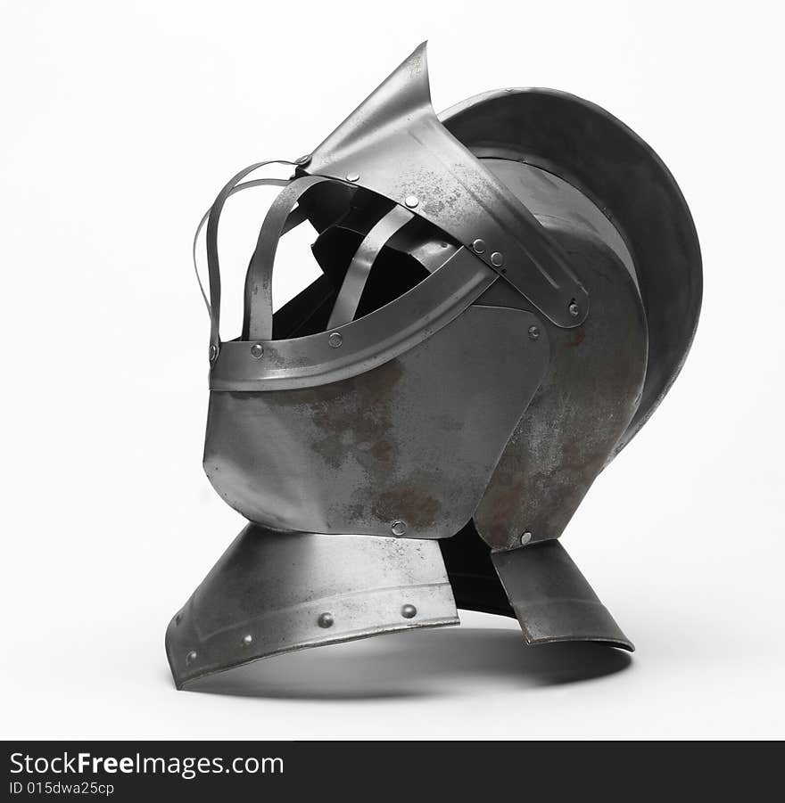 Image of a knight's metal helmet on a white background. Image of a knight's metal helmet on a white background