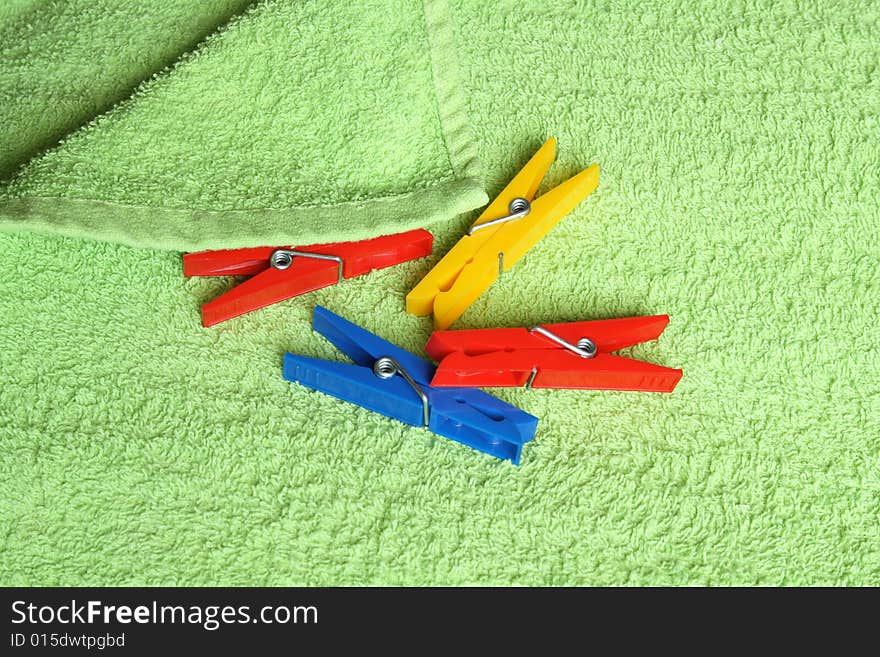 Variegated clothespins on towel