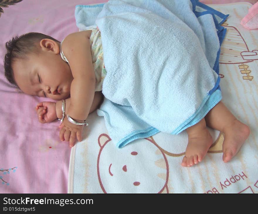 Sleeping Baby on a bed