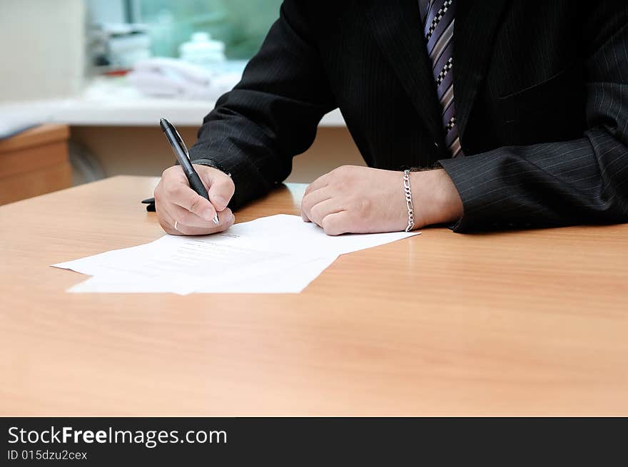 Office manager signing the document