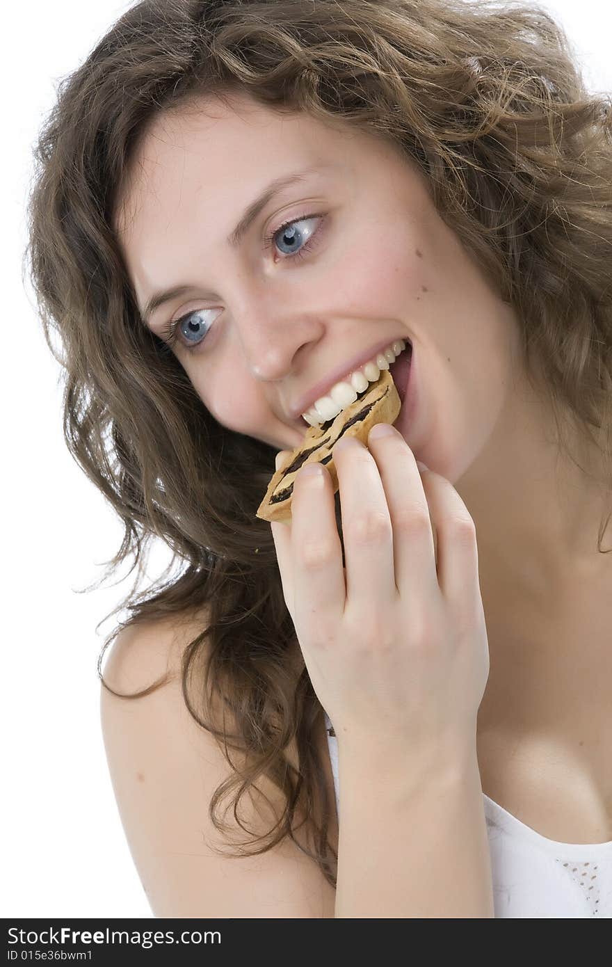 Young, beautiful woman eating a slice of cake. Young, beautiful woman eating a slice of cake