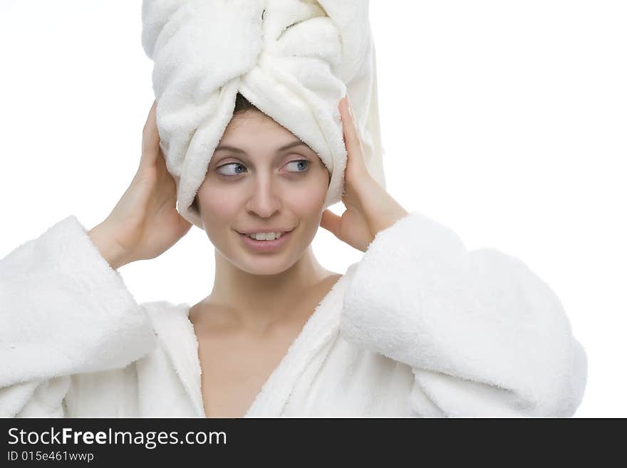 Young and smiling girl wearing a white bathrobe. Young and smiling girl wearing a white bathrobe