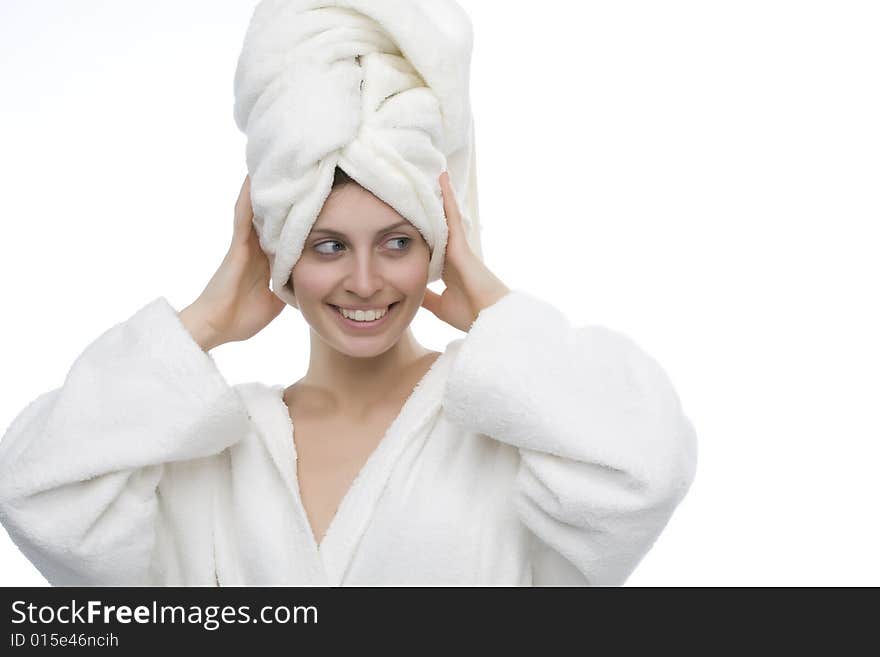 Young and smiling girl wearing a white bathrobe. Young and smiling girl wearing a white bathrobe