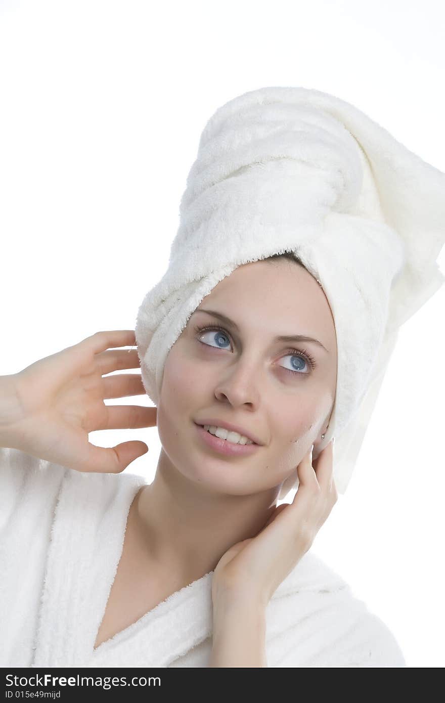 Young and smiling girl wearing a white bathrobe. Young and smiling girl wearing a white bathrobe