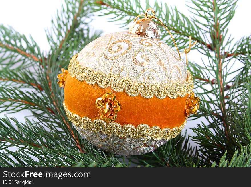 Decorative gold Christmas ball on a christmas tree. Decorative gold Christmas ball on a christmas tree