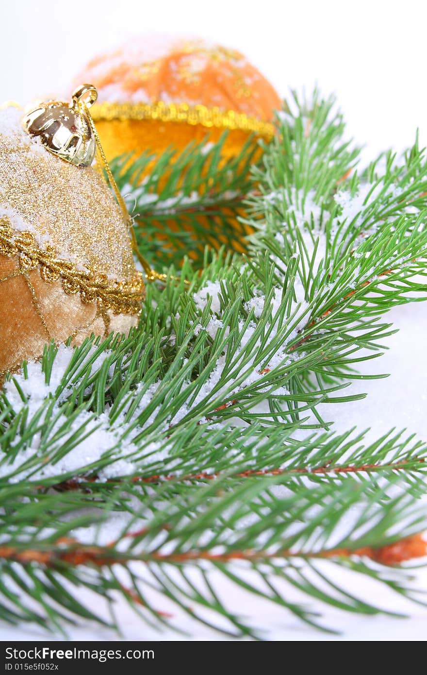 Decorative gold Christmas balls on a christmas tree. Decorative gold Christmas balls on a christmas tree