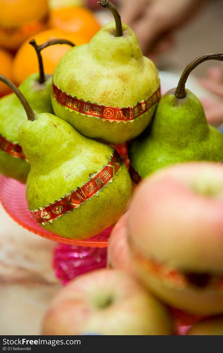 Fruits for chinese traditional praying wrap with prosperous greetings paper