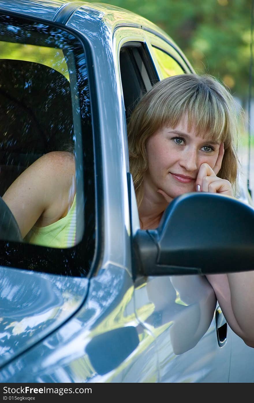 Portrait of the girl at the wheel the car. Portrait of the girl at the wheel the car