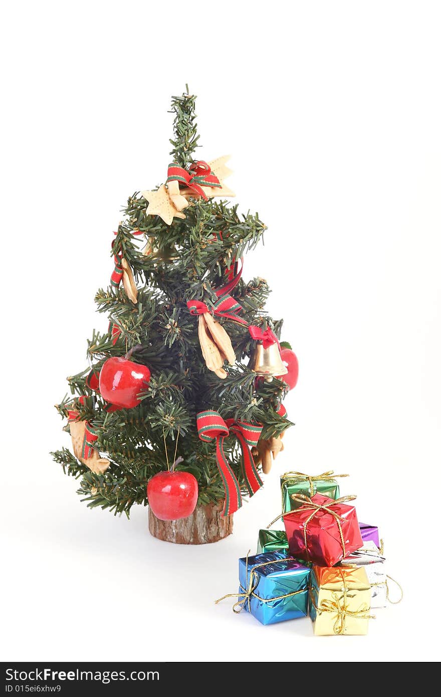 Christmas tree and color gift boxes on white background.