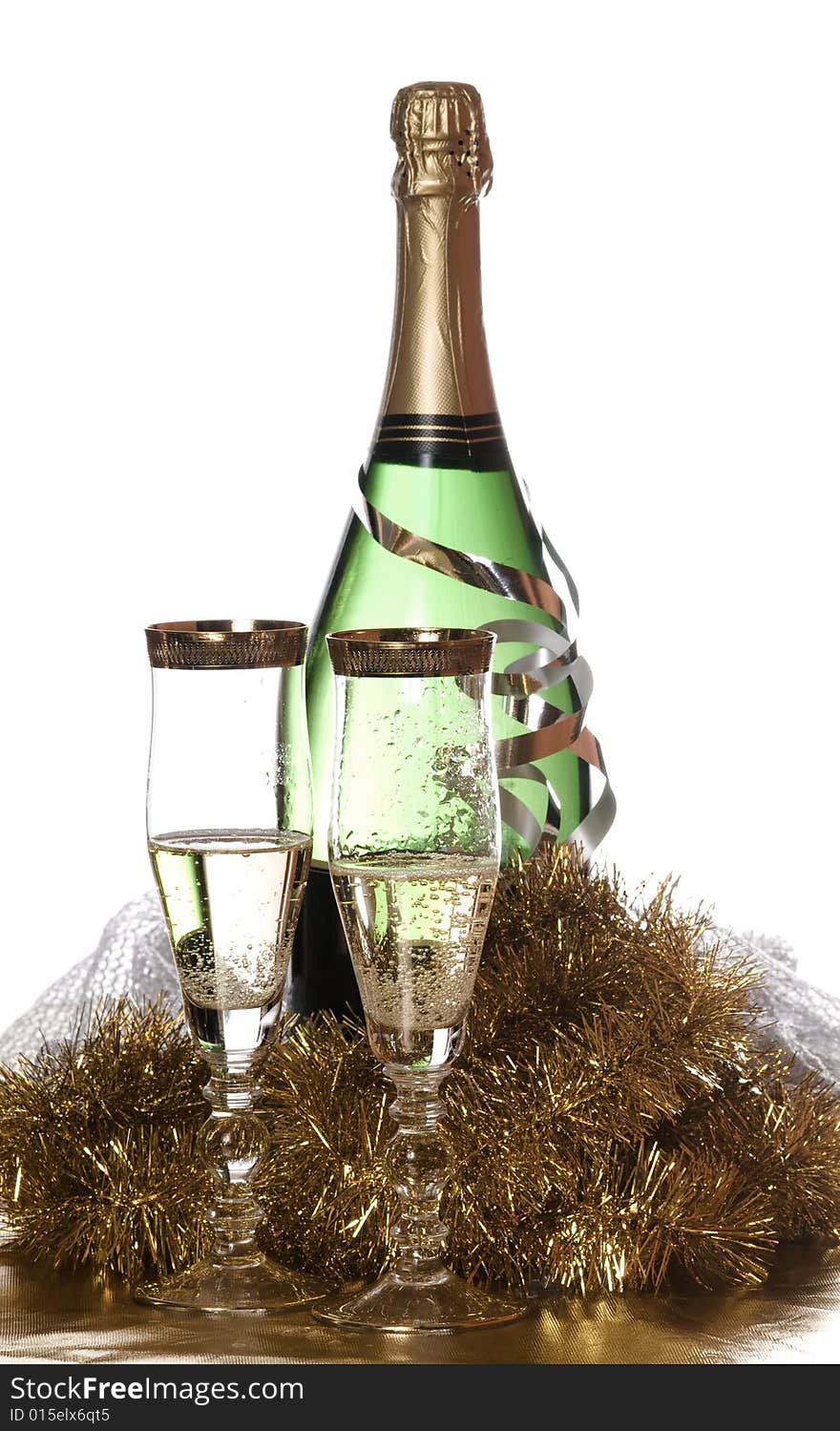 Champagne with two glasses and golden decoration