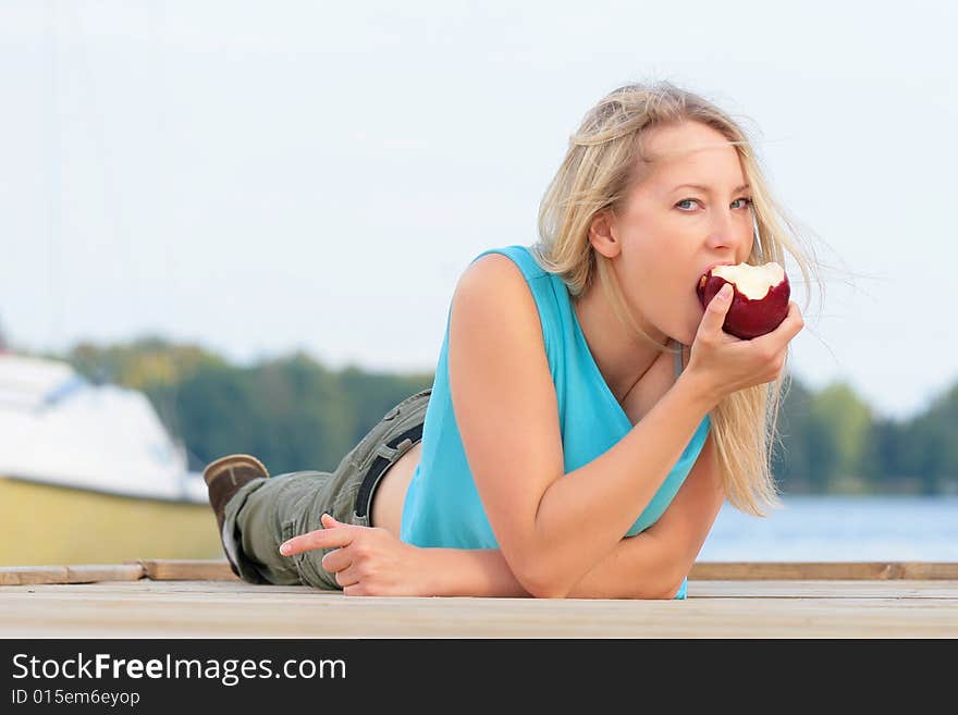 Girl eating the apple