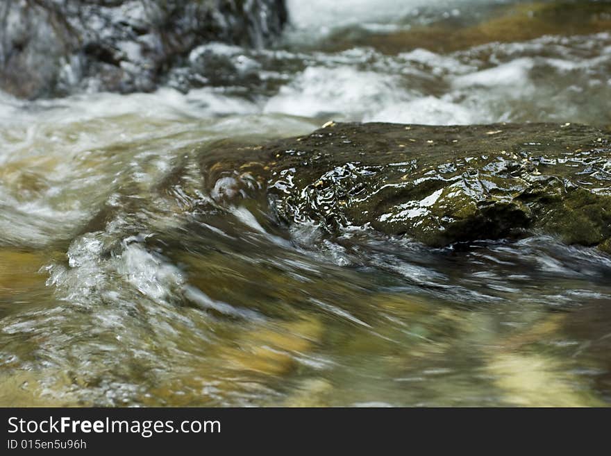 River flowing over a rock. River flowing over a rock