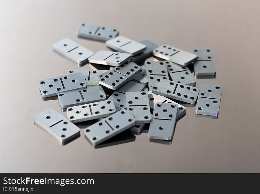 Steel dominoes on a polished surface