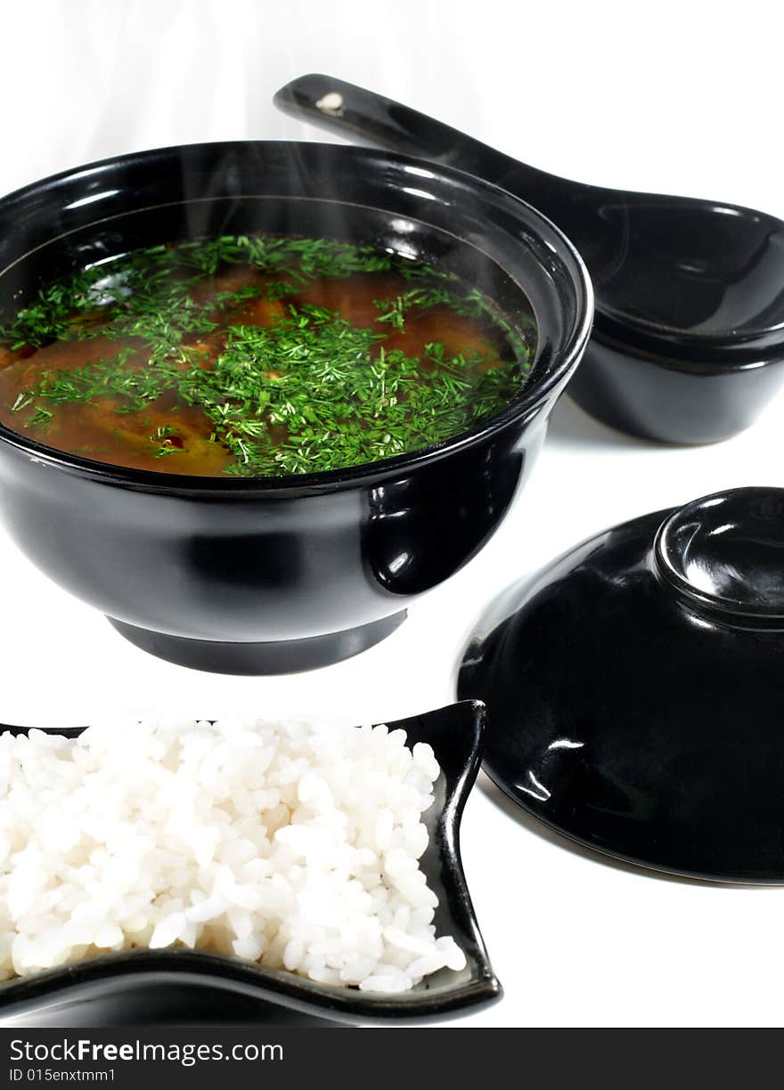 Japanese Soup in Black Dish. Isolated on White Background. Japanese Soup in Black Dish. Isolated on White Background