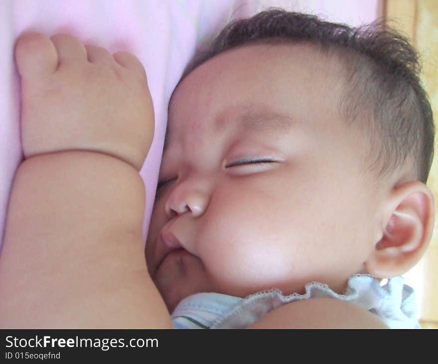 Sleeping Baby on a bed