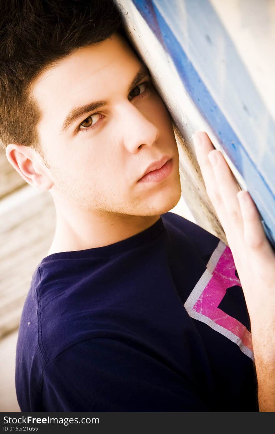 Young man portrait over grafted wall. Young man portrait over grafted wall.