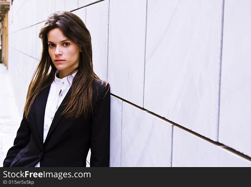 Long haired businesswoman staring at camera. Long haired businesswoman staring at camera.