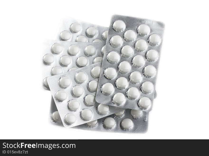 Pills in blister on white background