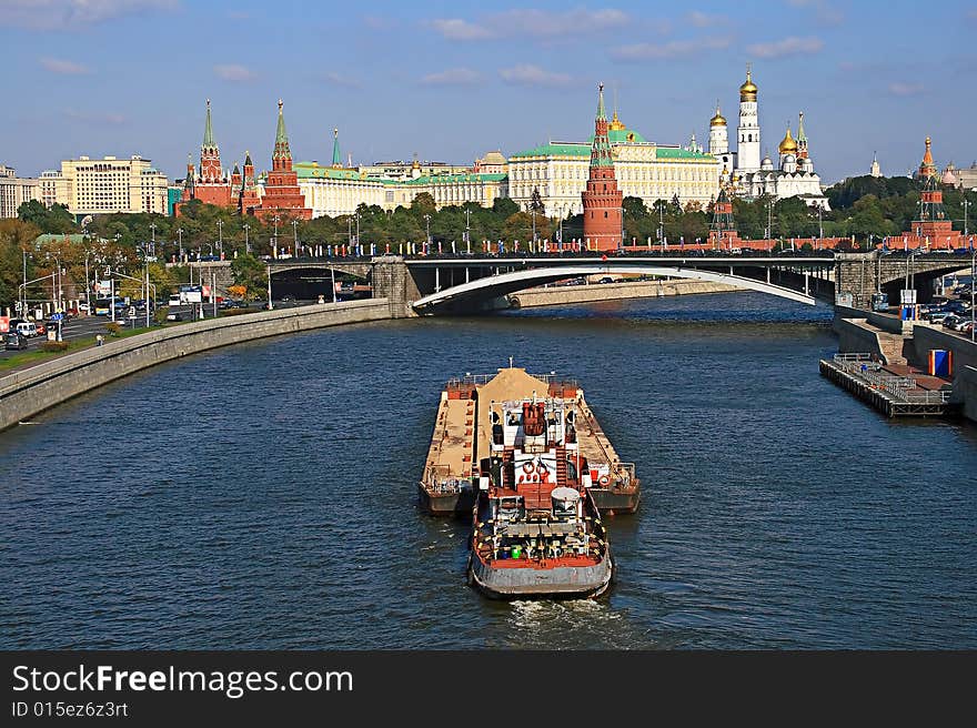 Kind from the bridge on the river with floating on it a vessel, on a background, the Moscow Kremlin. Kind from the bridge on the river with floating on it a vessel, on a background, the Moscow Kremlin