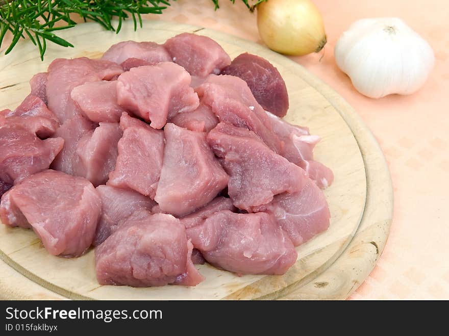 Many raw pork slices - cubes.