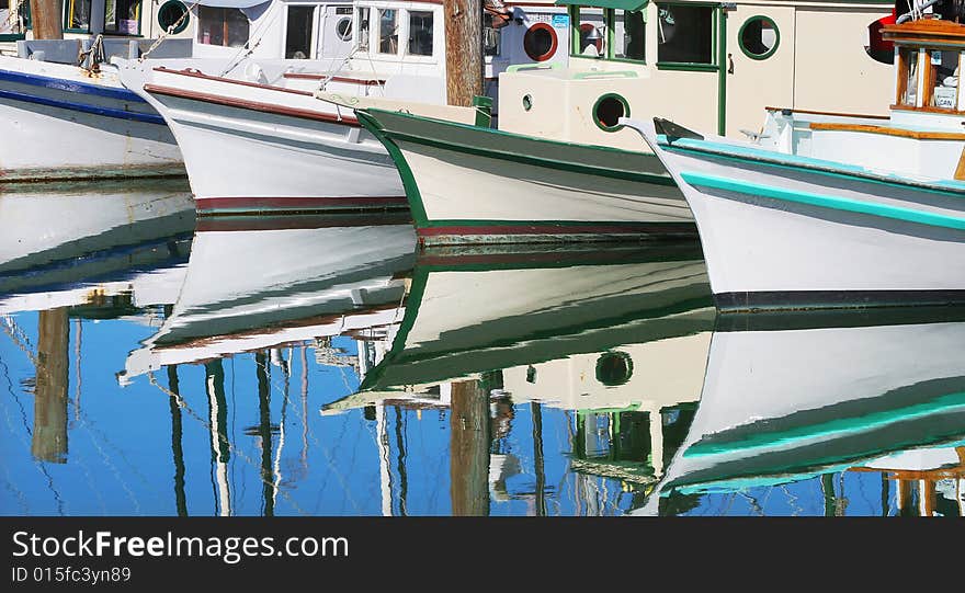 Boats reflection on the water in San Francisco marina. Boats reflection on the water in San Francisco marina.