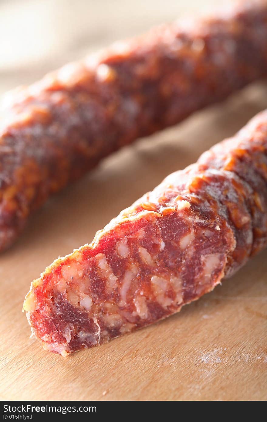 Roast sausage on the chopping board