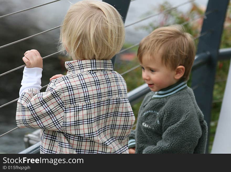 Small kids are playing and talking together. Small kids are playing and talking together