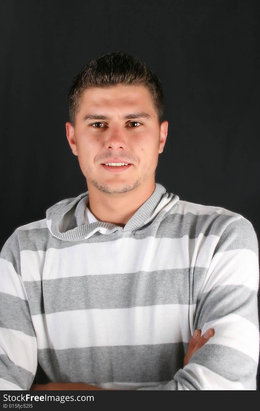 Male model in studio against black background