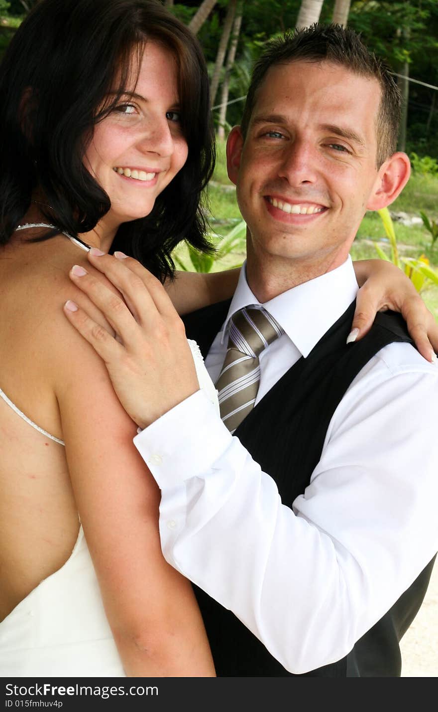 Happy bride and groom on their wedding day. Happy bride and groom on their wedding day.