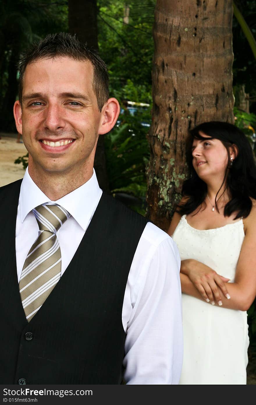 Happy bride and groom on their wedding day. Happy bride and groom on their wedding day.