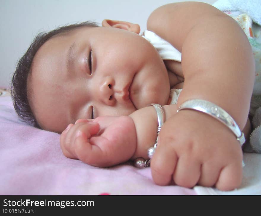 Sleeping Baby on a bed