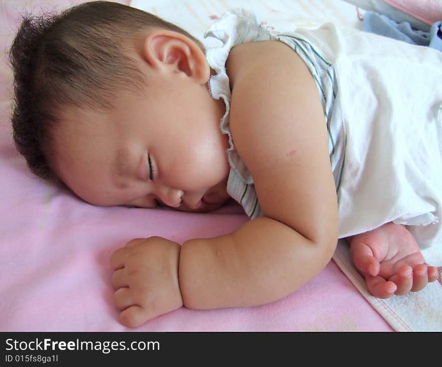Sleeping Baby on a bed