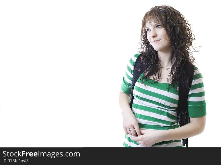 An attractive female college student looks onward. An attractive female college student looks onward