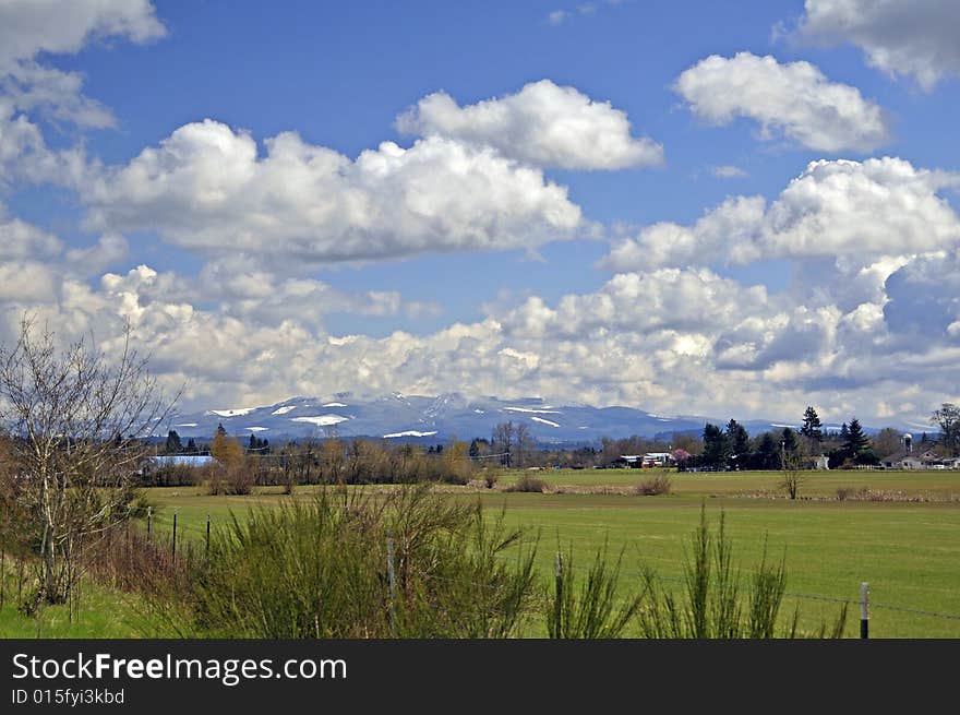 Cloudy day over the mountain with snow and blue sky