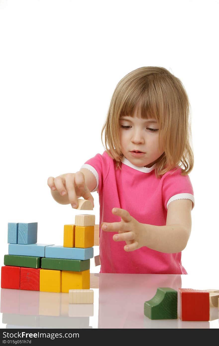 Little girl playing with cubes