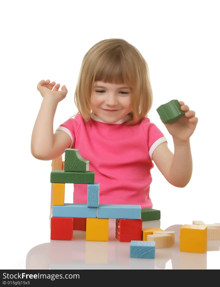 Little girl playing with cubes