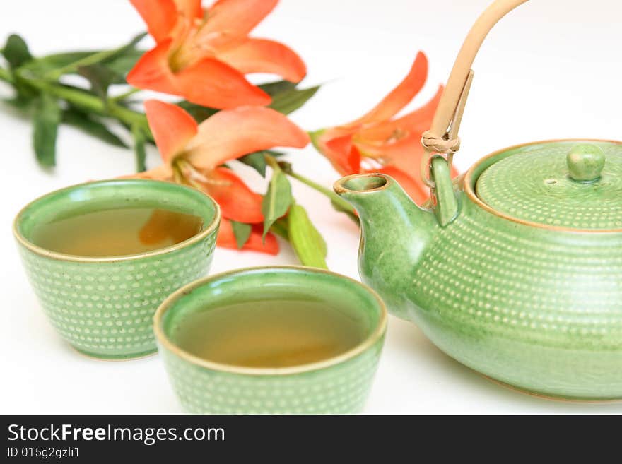 Teapot and cup isolated on a white background