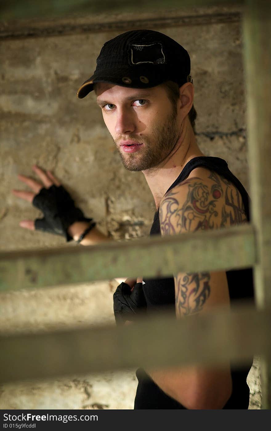 Young fellow in the tattooings on the ruins