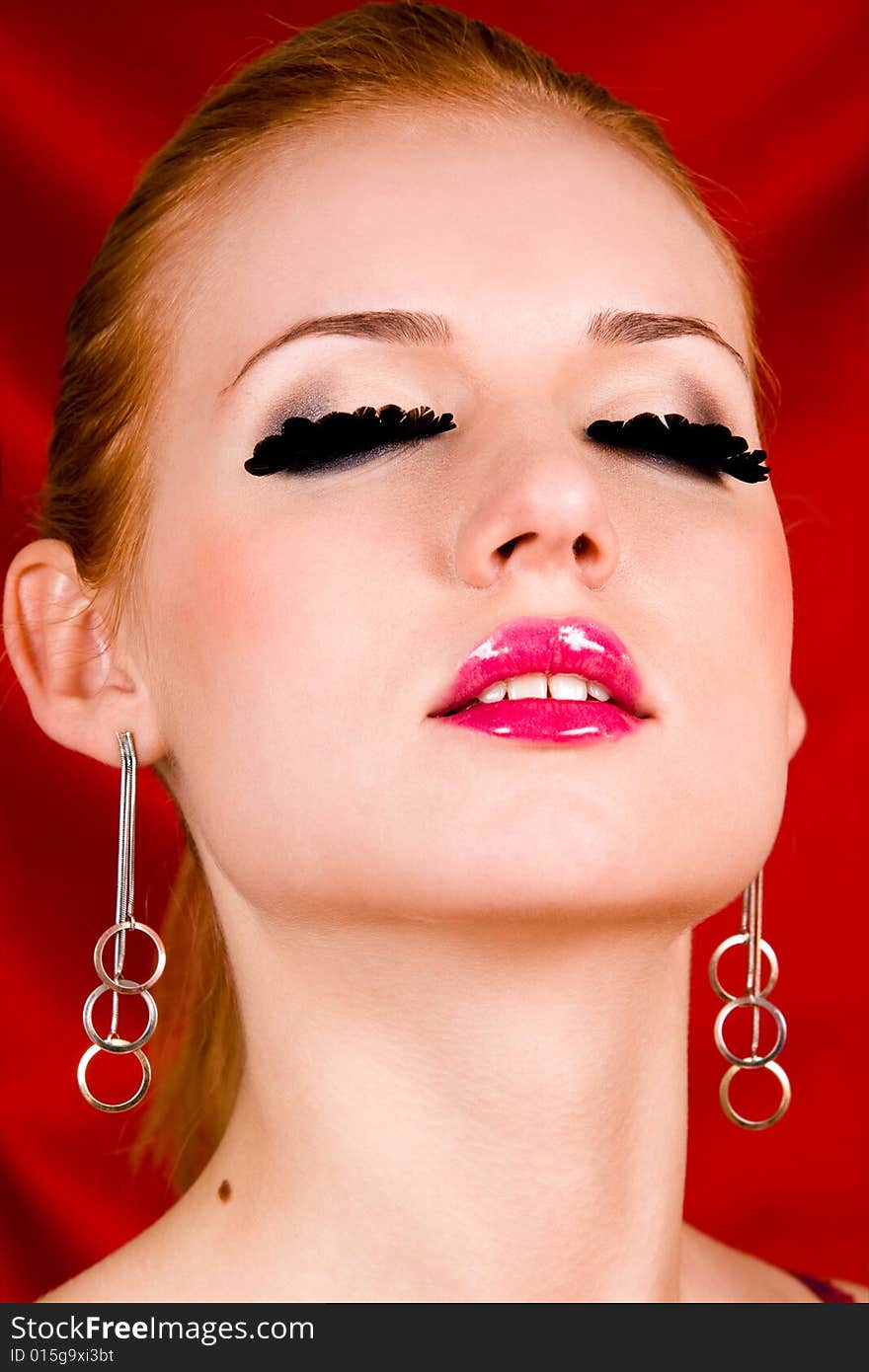 Glamour portrait of lovely blond young woman with big eyelashes. Glamour portrait of lovely blond young woman with big eyelashes