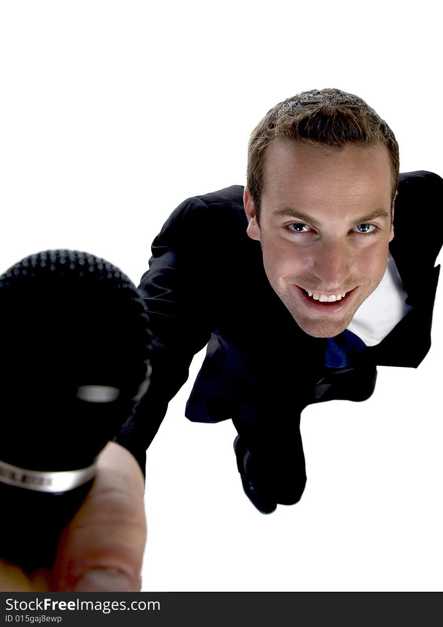 Businessman showing his mic on an isolated white background