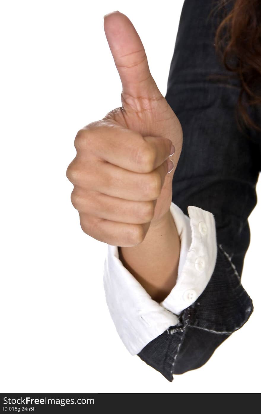 Thumb giving approval against white background