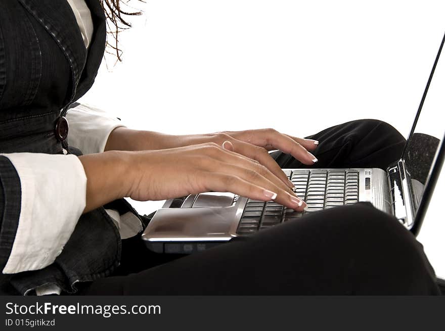 Female working on laptop against white background