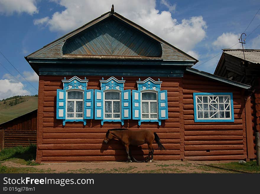 Old willage house with a house in Siberian old believers village