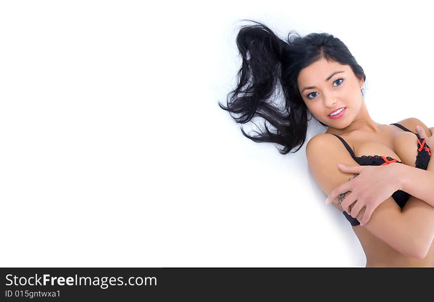 Portrait of the brunette with blue eye on white background