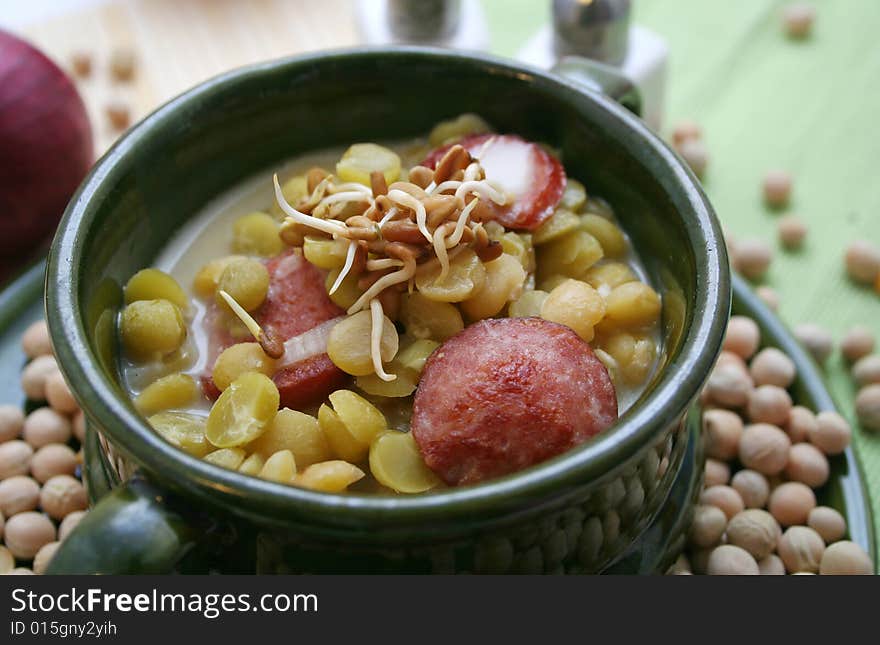 A fresh soup of peas with sausages