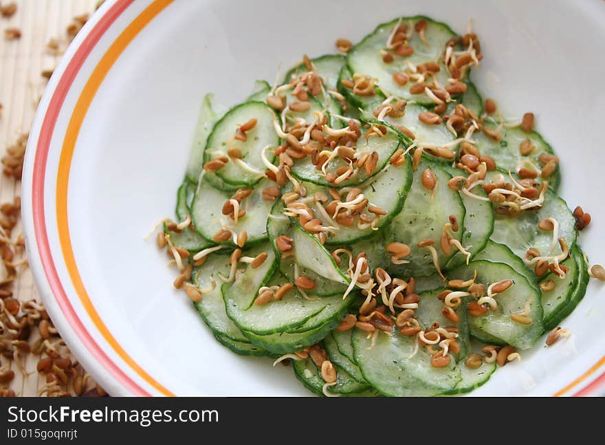 A fresh salad of cucumbers in a bowl